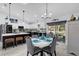 Bright, updated kitchen featuring a breakfast bar, white cabinetry, and modern appliances at 73 Bay Dr, Ocklawaha, FL 32179