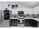 Stylish kitchen with stainless steel appliances and ample counter space at 73 Bay Dr, Ocklawaha, FL 32179