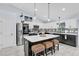 Modern kitchen featuring a large island and stainless steel appliances at 73 Bay Dr, Ocklawaha, FL 32179