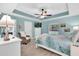 Serene main bedroom with light walls, ceiling fan, and a cozy chair at 73 Bay Dr, Ocklawaha, FL 32179