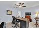 Functional office space with a dark desk, and a neutral color scheme at 73 Bay Dr, Ocklawaha, FL 32179