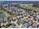 This aerial shot showcases the property's location within a neighborhood near a recreation center and green spaces at 7812 Se 167Th Mistwood Ln, The Villages, FL 32162
