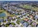 An aerial view shows the property's convenient access to community amenities, with mature landscaping at 7812 Se 167Th Mistwood Ln, The Villages, FL 32162