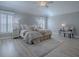 Serene main bedroom with plantation shutters, neutral color scheme, and spacious layout at 7812 Se 167Th Mistwood Ln, The Villages, FL 32162