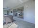 Covered sun room with ceiling fan and multiple sliding glass doors at 7812 Se 167Th Mistwood Ln, The Villages, FL 32162