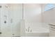 Elegant bathroom featuring a soaking tub, glass shower, and neutral color palette at 9729 Lost Creek Dr, Winter Garden, FL 34787