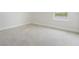 Bedroom featuring neutral carpeting and a large window with a water view at 9729 Lost Creek Dr, Winter Garden, FL 34787