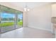 Bright dining area with sliding glass doors leading to the outdoor space and waterfront views at 9729 Lost Creek Dr, Winter Garden, FL 34787