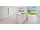 Bright kitchen features stainless steel appliances, granite countertops, and white cabinets at 9729 Lost Creek Dr, Winter Garden, FL 34787