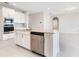 Modern kitchen featuring stainless steel appliances, granite countertops, and white cabinets at 9729 Lost Creek Dr, Winter Garden, FL 34787