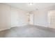 Spacious main bedroom featuring neutral carpeting, recessed lighting and attached bathroom at 9729 Lost Creek Dr, Winter Garden, FL 34787