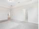 Spacious main bedroom featuring neutral carpeting, tray ceilings, and ample natural light at 9729 Lost Creek Dr, Winter Garden, FL 34787