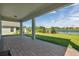 Enjoy the covered patio with brick flooring, offering tranquil backyard and lake views at 9729 Lost Creek Dr, Winter Garden, FL 34787