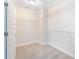 Walk-in closet featuring wire shelving and neutral carpeting for optimal storage at 9729 Lost Creek Dr, Winter Garden, FL 34787