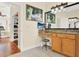 Vanity area featuring a small desk area, granite counters, and storage at 995 Hidden Blf, Clermont, FL 34711