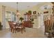 Formal dining room with traditional wooden furniture and chandelier lighting at 995 Hidden Blf, Clermont, FL 34711