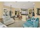 Inviting living room with tile floors, arched doorways, and view of the kitchen and dining area at 995 Hidden Blf, Clermont, FL 34711