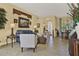Comfortable living room features neutral decor, tasteful artwork, and tile flooring at 995 Hidden Blf, Clermont, FL 34711