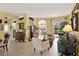 Spacious living space with multiple seating areas, tile flooring, and views to the patio at 995 Hidden Blf, Clermont, FL 34711