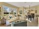 Inviting living space featuring comfortable seating arrangements and a view into the breakfast nook at 995 Hidden Blf, Clermont, FL 34711