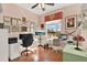Bright office space with hardwood floors, large windows, and dual desk setup at 995 Hidden Blf, Clermont, FL 34711