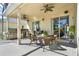 Covered outdoor patio area complete with outdoor kitchen and dining set at 995 Hidden Blf, Clermont, FL 34711
