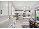 This bright kitchen boasts ample counter space and modern stainless steel appliances at 10177 Spring Lake Dr, Clermont, FL 34711