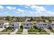 Street view of the houses showcasing their well-manicured lawns and diverse architectural styles at 10177 Spring Lake Dr, Clermont, FL 34711