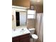 A well-lit bathroom with a shower and large mirror at 1108 Ben Hope Dr, Leesburg, FL 34788