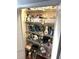 Linen closet with plentiful shelves and a large variety of household and cleaning items at 1108 Ben Hope Dr, Leesburg, FL 34788