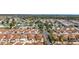 Neighborhood aerial view showcases a well-planned community with neatly arranged homes and greenery at 1202 San Bernardo Rd, The Villages, FL 32162