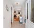 Inviting entryway with tile floors, a decorative cabinet, and an open view into the dining and living areas at 1202 San Bernardo Rd, The Villages, FL 32162