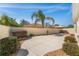 This outdoor patio area features a large patio, rock garden and mature plants at 1202 San Bernardo Rd, The Villages, FL 32162