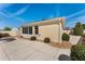 A view of the home's screened in lanai with exterior lighting and adjacent landscaping at 1202 San Bernardo Rd, The Villages, FL 32162