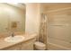 Neutral bathroom with a shower-tub combo, vanity, and a toilet at 1215 Eagle Ridge Dr, The Villages, FL 32162