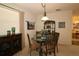 Dining area featuring a round glass table and neutral decor at 1215 Eagle Ridge Dr, The Villages, FL 32162