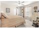 Comfortable bedroom with a four-poster bed, plush carpet, and ample natural light creating a tranquil retreat at 12225 Se 173Rd Pl, Summerfield,, FL 34491