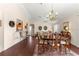 Formal dining room area featuring hardwood floors and a chandelier at 12225 Se 173Rd Pl, Summerfield,, FL 34491