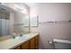 Bathroom featuring a single sink vanity and a shower-tub combo at 12418 Clubhouse Ct, Tavares, FL 32778