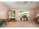 Open living area showing the front door and large window at 12418 Clubhouse Ct, Tavares, FL 32778