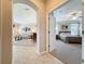 View of the bedroom and the living room space from the tiled hallway at 12919 Freeman St, Windermere, FL 34786