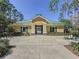 Exterior view of the community building with green roof and bicycle racks and gate to the pool at 12919 Freeman St, Windermere, FL 34786