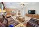 Open-concept living room featuring tile floors, ceiling fan, and connected dining and kitchen area at 12919 Freeman St, Windermere, FL 34786