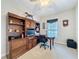 Well-appointed home office featuring a desk, built-in storage, and natural light from a window at 12919 Freeman St, Windermere, FL 34786