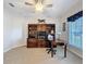 Home office featuring built-in shelving, a desk, and a window with natural light at 12919 Freeman St, Windermere, FL 34786