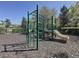 Community playground area with multiple climbing structures, a slide, and monkey bars at 12919 Freeman St, Windermere, FL 34786