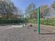 Community playground swing set with safety mulch and a fence surrounding the area at 12919 Freeman St, Windermere, FL 34786