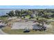 Aerial view of community recreation area with beach volleyball and lake views at 1322 Howard Rd, Leesburg, FL 34748