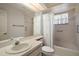 Bathroom with a bathtub/shower combination, toilet, sink and mirror at 1322 Howard Rd, Leesburg, FL 34748