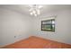 Cozy bedroom with natural light, ceiling fan, and hardwood floor at 1322 Howard Rd, Leesburg, FL 34748